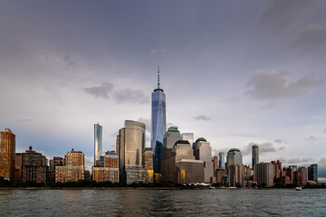 Cityscape of the Downtown of New York City at dusk. Lower Manhattan and financial district from Hudson River - obrazy, fototapety, plakaty