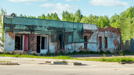 destroyed shop building after with broken windows after missile strike