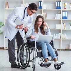 Disabled patient on wheelchair visiting doctor for regular check