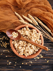 oatmeal spoon on wooden background
