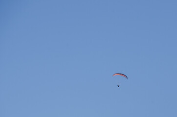 A paraglider in the blue sky, large image with fine detail and lots of copy space