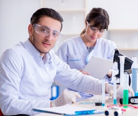 Team of chemists working in the lab