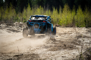 Summer UTV, ATV & offroad driving in dust. Quad racing © Antonio
