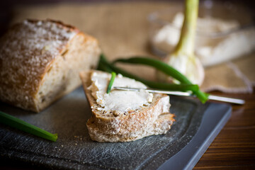 Fototapeta na wymiar Homemade buckwheat bread with garlic cheese spread