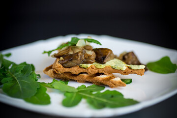 fried toast with cheese spread, arugula and fried mushrooms