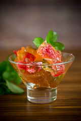 colored sweet fruit jelly in a glass glass