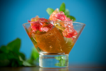 colored sweet fruit jelly in a glass glass