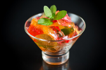 colored sweet fruit jelly in a glass glass
