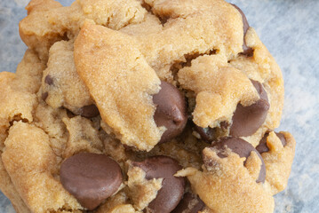 Warm and gooey close up of a chocolatechip cookie right out of the oven