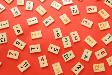 Numbers background. Rummikub tiles on a red background.