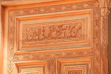 beautiful carved wooden doors with brass inserts and massive brass handles