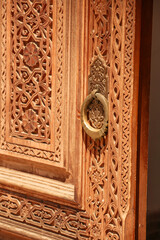  beautiful carved wooden doors with brass inserts and massive brass handles