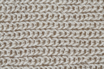 grey hand knitted scarf close up
