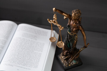 statue of justice and book