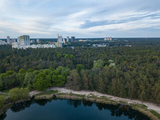 Fototapeta na wymiar Lake in the park in spring. Aerial drone view.