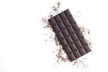 Isolated dark chocolate bar and shavings top view