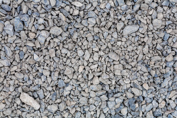 brick rubble debris on construction site. inorganic crushed stone, non-round, loose material with grains. Artificially obtained by crushing coarse-grained rocks and pebbles, accidentally mined