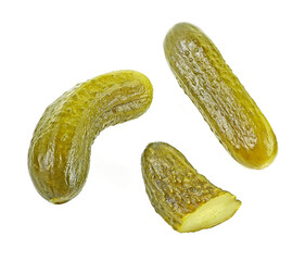 Delicious marinated pickled cucumbers isolated on a white background, top view. Pickled cucumbers and slices.