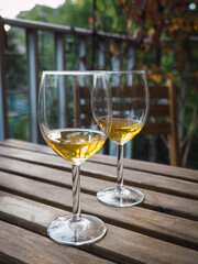 Two glass of white wine standing on the table