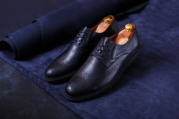 leather shoes on a dark blue background