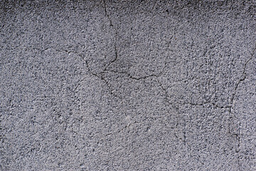 gray rough cracked concrete texture background.