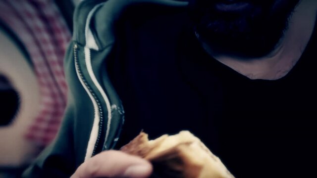 Displaced distortion fx: a man eating a slice of Panettone (a traditional Italian type of sweet bread loaf, most popular around Christmas and New Year).
