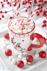 Cup of creamy hot chocolate with melted marshmallows for christmas holiday