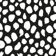 Abstract doodle spots seamless repeat pattern. Scribbled dots all over surface print on black background.