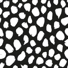 Behang Abstracte doodle vlekken naadloze herhalingspatroon. Gekrabbelde stippen over het hele oppervlak op zwarte achtergrond. © MoJX.Studio