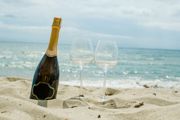 champagne bottle on the beach