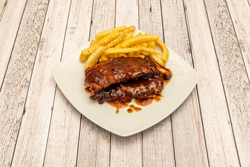 Pork ribs that melt in your mouth with barbecue sauce and portion of chips