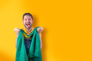 Brazilian man with Brazilian flag