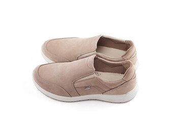 Pair of running shoes isolated in white background. Close-up of elegant gray shoes for adult man on white background.