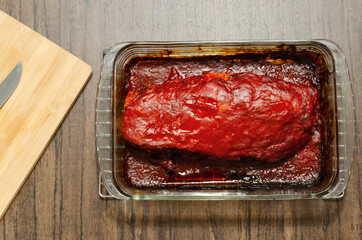 Ribs prepared in the oven with barbecue sauce. Roasted ribs served on plate on wooden table.