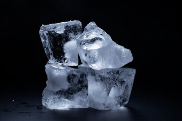Blocks of cracked ice on black background