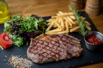 beef steak with salad and french fries