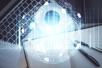 Social network hologram drawings over computer on the desktop background. Top view. Double exposure.