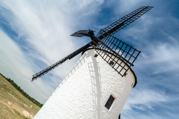 Traditional Spanish windmill in Campo de Criptana, Spain, on the famous Don Quixote Route
