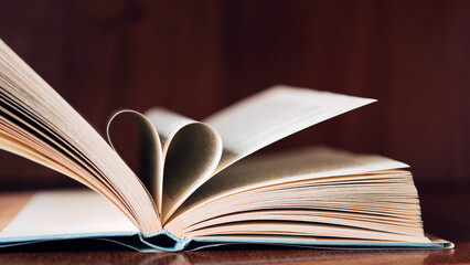 books take a paper page of it make heart shaped. Concept gradually understand and learn to care for the heart.