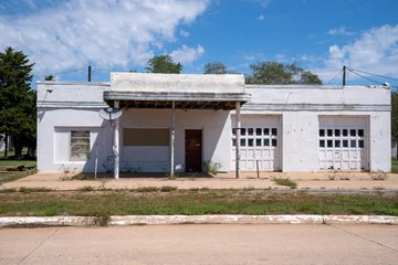  Abandoned gas station, weathered and rusted, along old historic Route 66 © MelissaMN