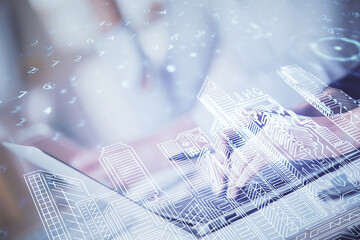 Double exposure of woman hands typing on computer and buildings drawing. Smart-city concept.