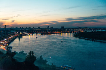 Kiev, Ukraine - May, 22, 2021. Evening panorama of the city overlooking the Dnieper river. Sunset.