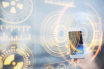 Double exposure of tech icon hologram and woman holding and using a mobile device. Technology concept.