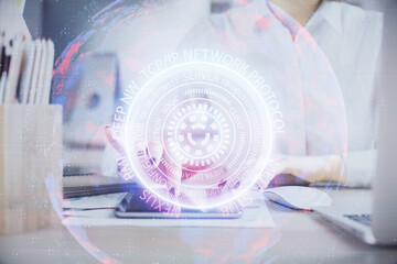Double exposure of tech icon hologram and woman holding and using a mobile device. Technology concept.