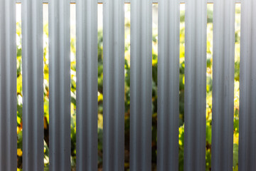 Natural abstract background of metal fence in shape of lines.