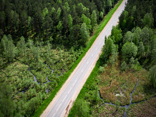 Fototapeta na wymiar The road through the forest. Top view.