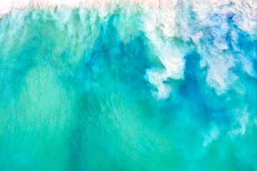 Top view aerial drone photo of ocean seashore with beautiful turquoise water and sea waves. Caribbean resort. Vacation travel background.
