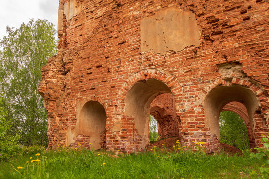 The crumbling facade of an abandoned brick church. Side view. Russia, Smolensk region, 1753.