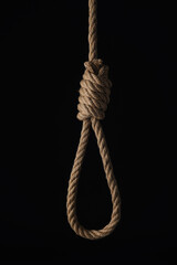 Rope noose with knot on black background