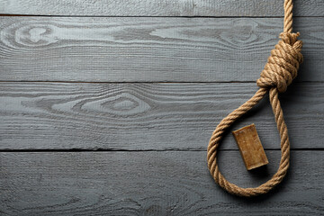 Rope noose and soap bar on grey wooden table, flat lay. Space for text - obrazy, fototapety, plakaty